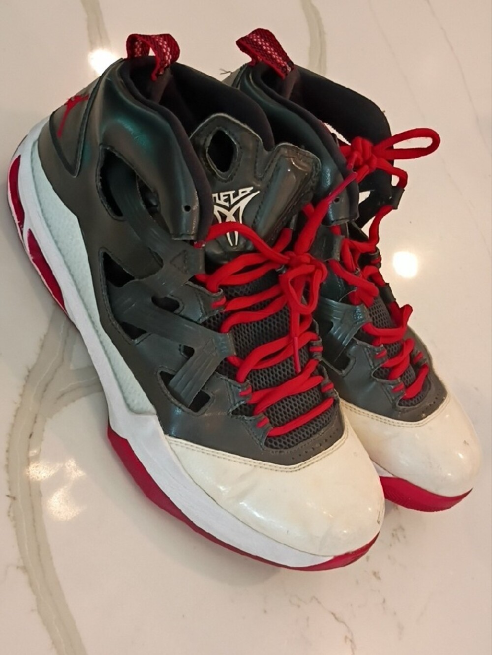 Men's 11.5 Jordan Melo M9

Athletic High-Top Sneakers in Gray, White & Red